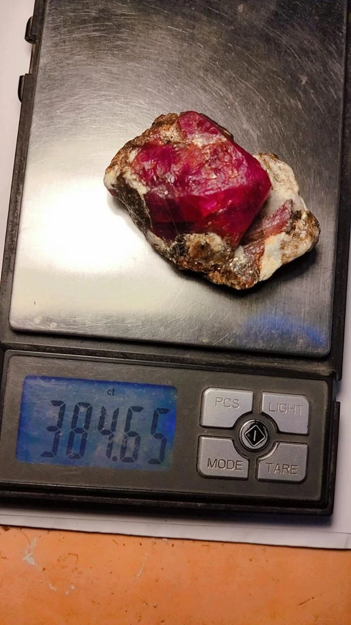Ruby specimen on a scale — client photograph